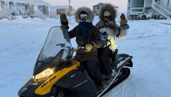 on snowmobiles at clinic